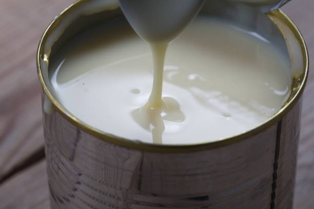 istock Open jar of condensed milk 818177136