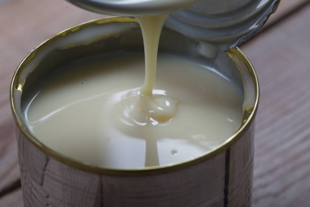istock Open jar of condensed milk 818177646