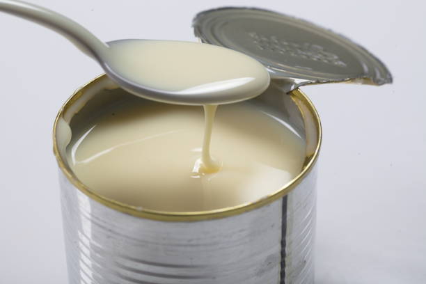 istock Open jar of condensed milk 818181734