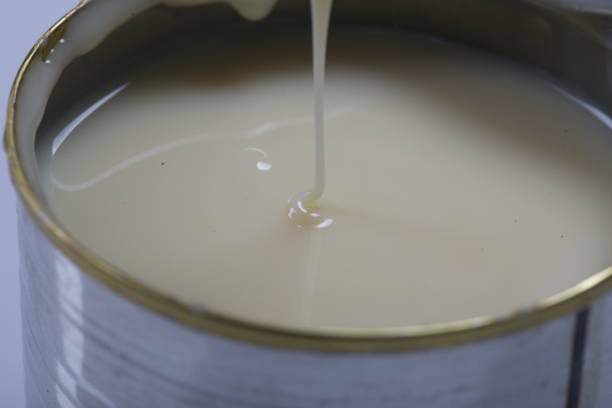 istock Open jar of condensed milk 818187328