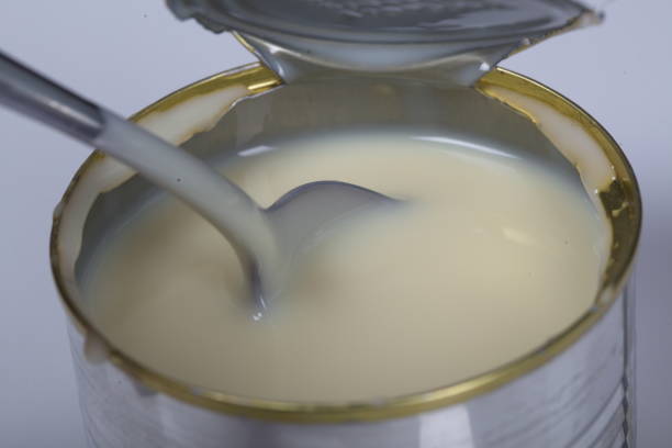 istock Open jar of condensed milk 818192554