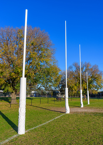 Four Australian Football goal posts in a suburban park in Mrlbourne Australia