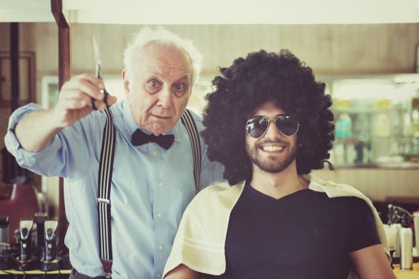 Barber and his client in a barber shop