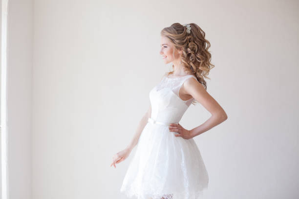 istock beautiful bride posing wedding hairstyle and dress 818249312