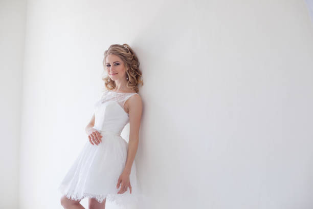 istock beautiful bride posing wedding hairstyle and dress 818251724