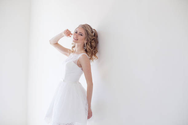 istock beautiful bride posing wedding hairstyle and dress 818251884