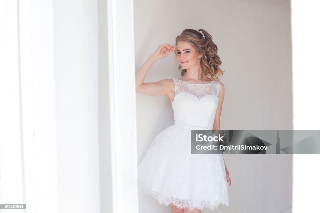 marathon meget debat Pretty Girl In A Short White Wedding Dress Stock Photo - Download Image Now  - Mini Dress, Wedding Dress, White Color - iStock