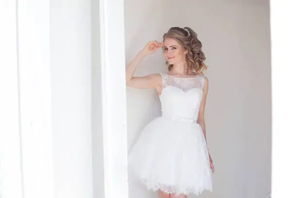pretty girl in a short white wedding dress 1