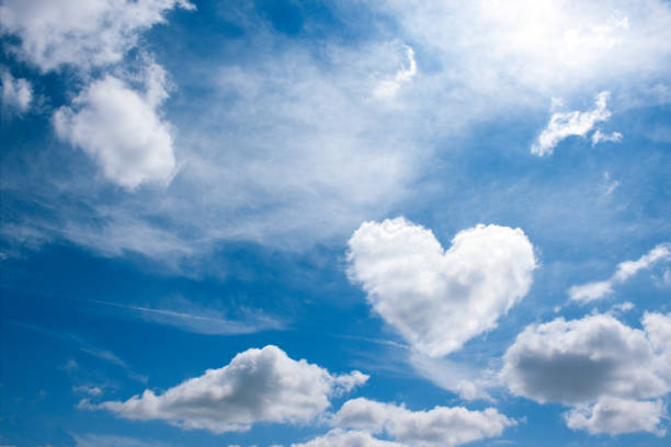 istock heart cloud on blue sky background. weather or love abstract symbol  with space for text 818259418