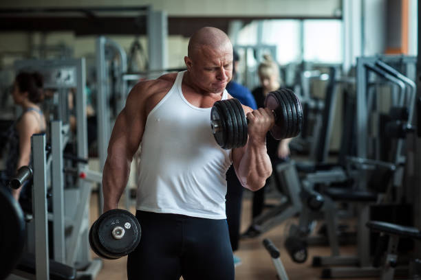 istock Bodybuilder deals with dumbbells 818261182