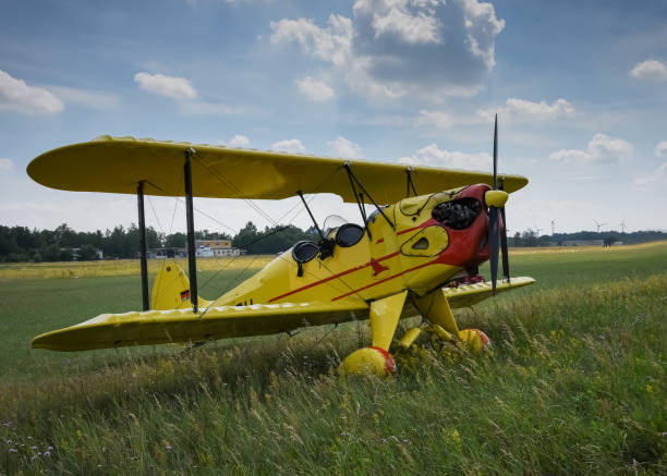 istock Light aircraft. Light yellow airplane on airport grass. Light general aviation plane on final 818269300