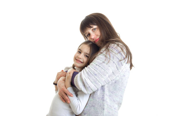 istock mother hugs with her little daughter in studio 818269764