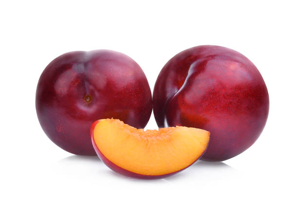 istock two whole and slice of red cherry plums isolated on white background 818277298