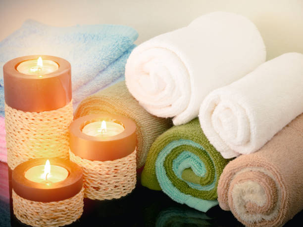 istock Towel with candle in bathroom,spa concept 818282696