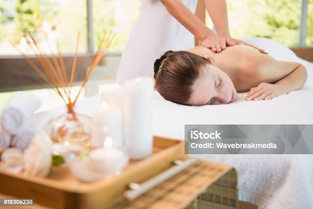 Attractive Woman Receiving Back Massage At Spa Center Stock Photo - Download Image Now