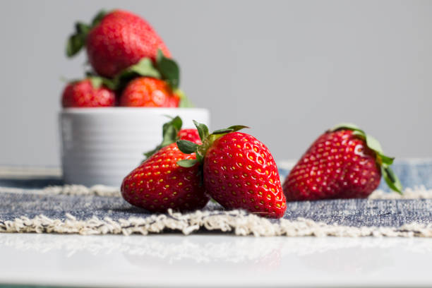 istock Juicy fresh strawberries in a white bowl 818326746