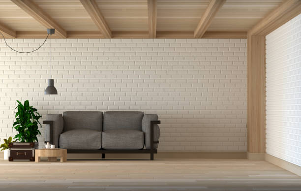 istock sofa in the living room 3D Rendering,in front of white wall interior design. 818327404