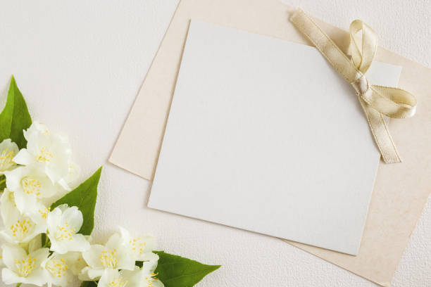istock White jasmine with blank greeting card on the white background. Fresh, fragrant flowers. 818352068