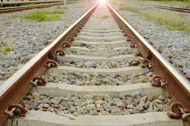 istock railway perspective with sunlight on station 818354334