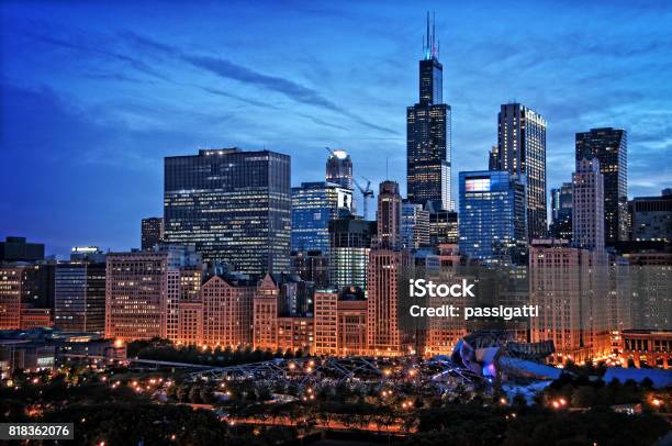 Chicago Lakefront Skyline Cityscape At Night By Millenium Park With A Dramatic Cloudy Sky Stock Photo - Download Image Now