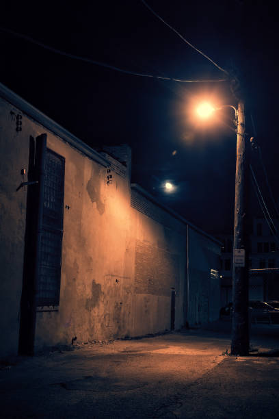 istock Dark City Alley at Night with Moon 818363486