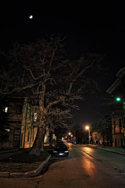 istock Dark City Street at Night with Moon 818364908