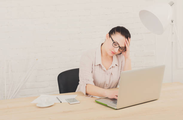 istock Tired middle-aged business woman in office 818373670