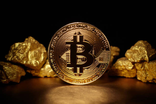 Golden Bitcoin Coin Berlin, Germany - July16, 2017: Golden Bitcoin Coin and mound of gold. Bitcoin cryptocurrency. Business concept. gold bitcoin stock pictures, royalty-free photos & images
