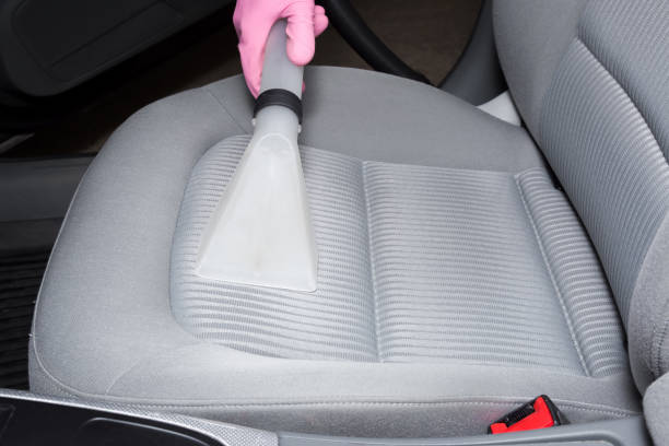 istock Car interior textile seats chemical cleaning with professionally extraction method. Early spring cleaning or regular clean up. 818383554