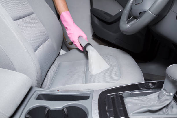 istock Car interior textile seats chemical cleaning with professionally extraction method. Early spring cleaning or regular clean up. 818383808