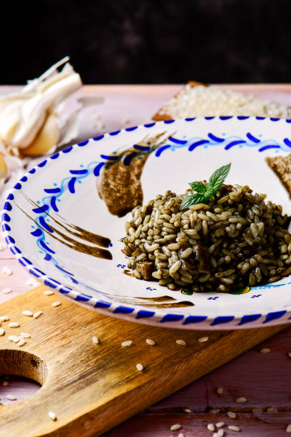 istock spanish arroz negro or black paella 818390976