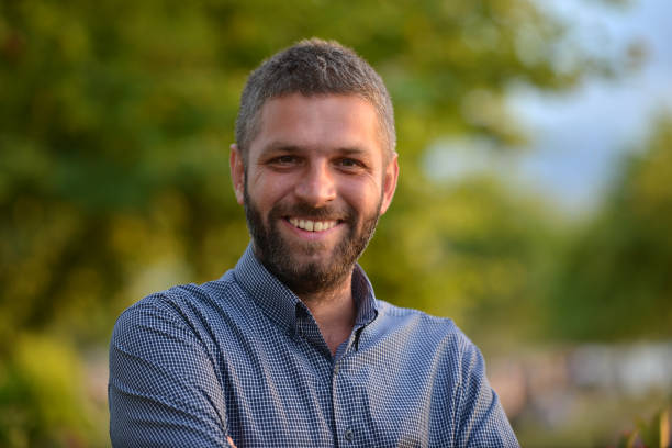istock Portrait of smiling young man 818397288
