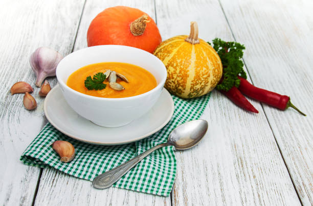 istock Pumpkin soup and  pumpkins 818400394