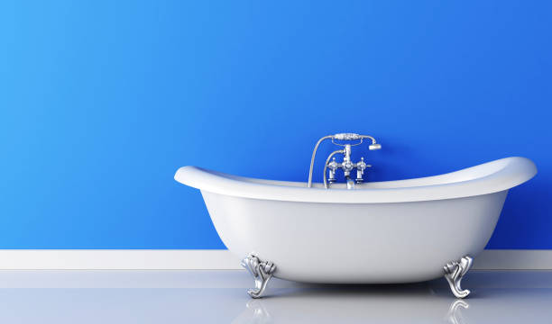 istock Bathtub and faucet and blue wall 818407252