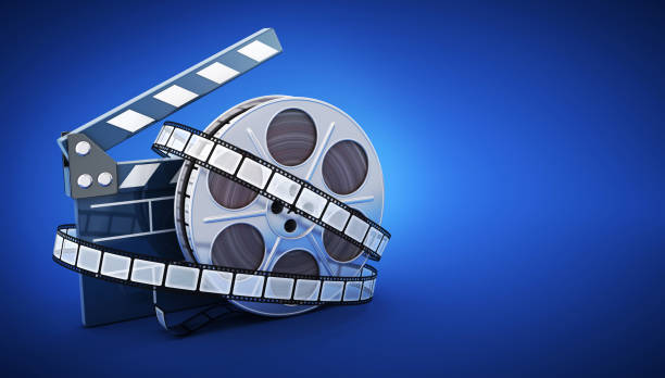 istock Spool and film on blue background 818407632