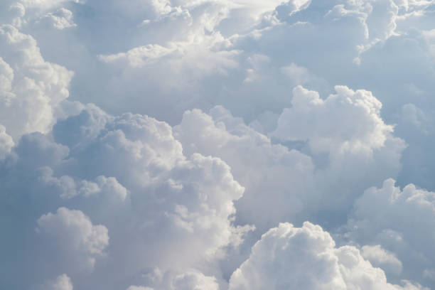 istock Aerial view from the plane of fluffy rain cloud in daytime - Cloudscape 818409172
