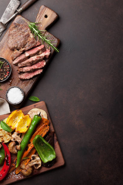 istock Grilled vegetables and beef steak 818413734
