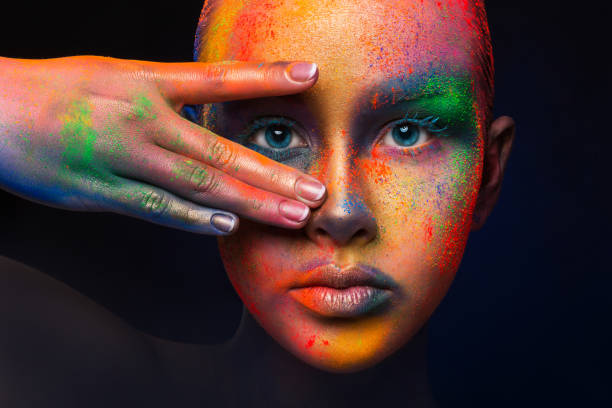 istock Model with colorful art make-up, close-up 818430052