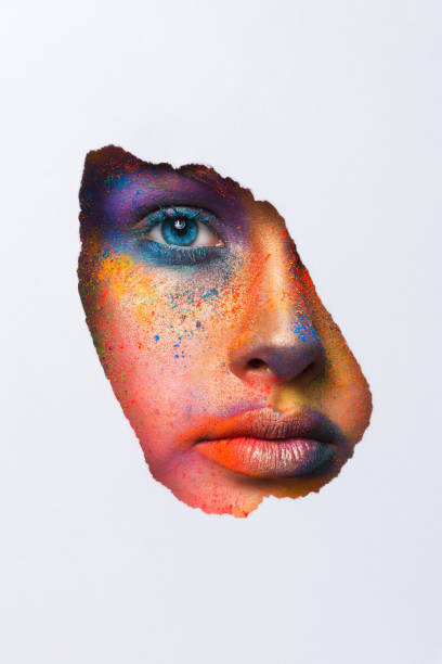 istock Face of model with colorful art make-up, close-up 818430198