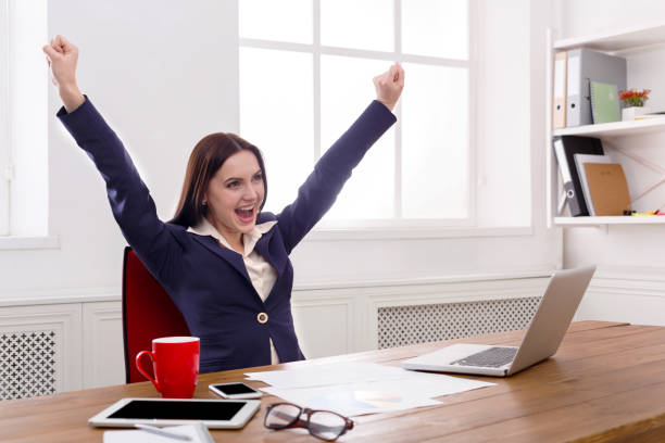 istock Business woman enjoying successful project 818447318