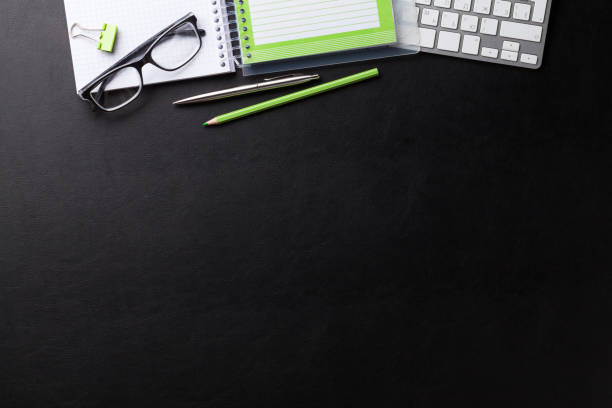 istock Office desk with computer and supplies 818447856