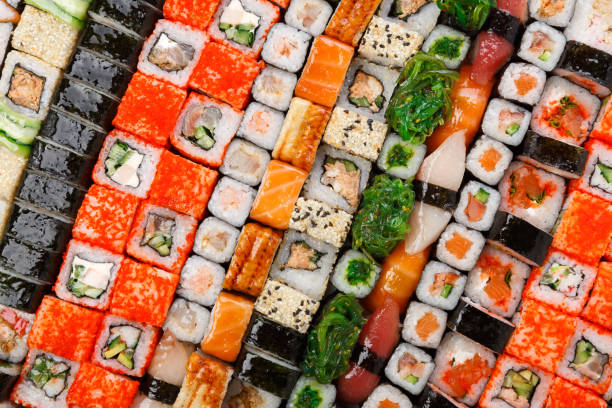 istock Set of sushi, maki and rolls background 818480110