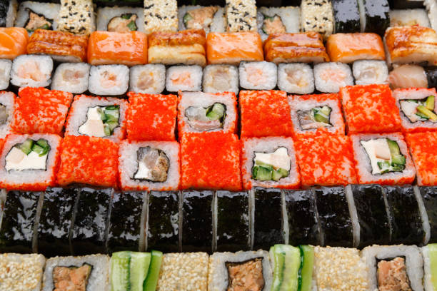 istock Set of sushi, maki and rolls background 818481460