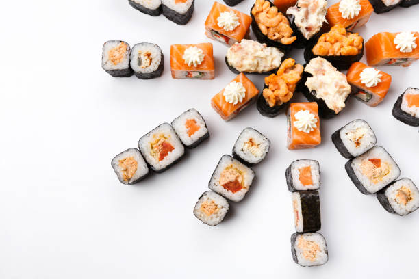 istock Set of sushi, maki and rolls isolated on white background 818507164