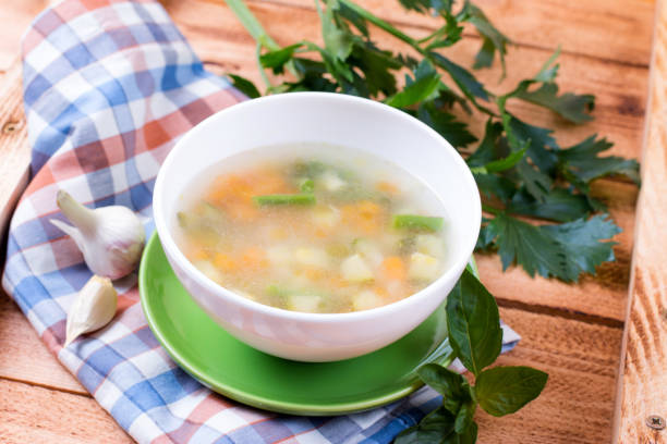 istock Vegetable soup on a wooden background 818559720