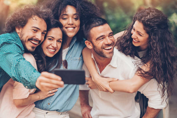 istock Group of friends gathered close for a selfie 818562548
