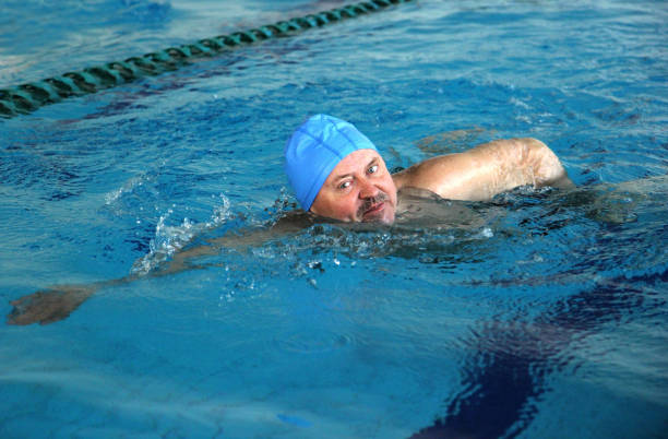 istock Middle Aged man in Swimming Pool 818569792