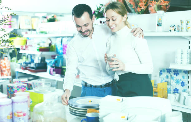 istock Couple selecting crockery in store 818575454