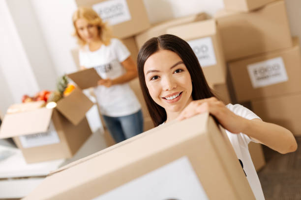 istock Wonderful energetic woman getting the shipments ready 818575476