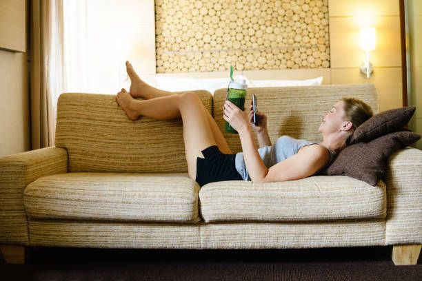 istock Woman using smartphone in bed room. 818592492
